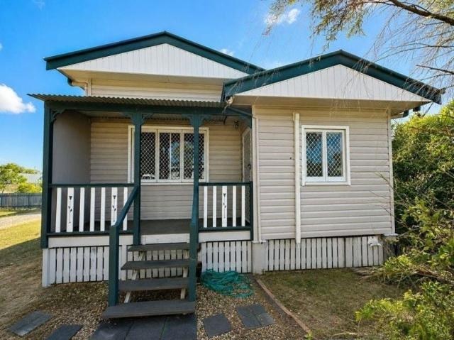 Cottage style home with a Shed
