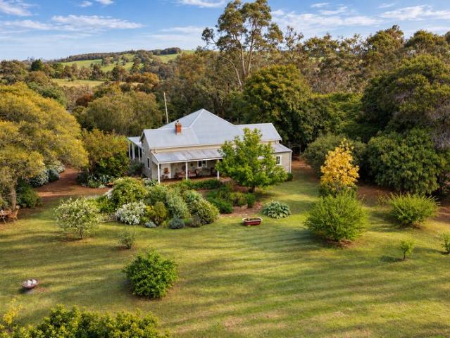 Country Charm Meets Botanical Paradise on the River's Edge