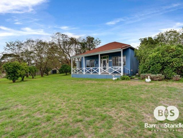 Country Charm. Peaceful Acreage. Endless Potential