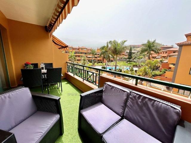 Cozy apartment located in a building with community pool and gardens