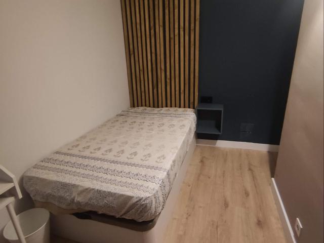 Cozy bedroom with a balcony in co living