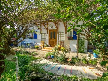 Cozy house with idyllic garden