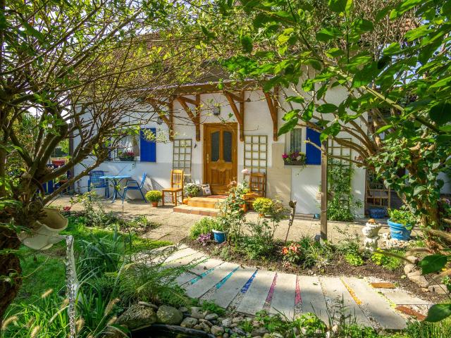 Cozy house with idyllic garden