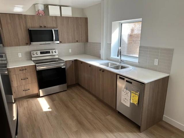 Cozy 2 Bedroom Gem with Private Backyard & Modern Kitchen