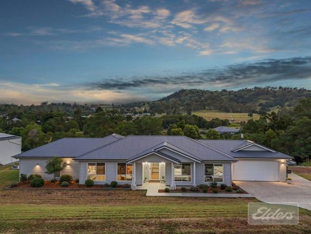 Class, Style & Space Contemporary Comfort Meets Acreage Living!