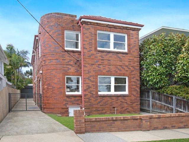 Classic Art Deco Up and Down Duplex in a Coveted Location