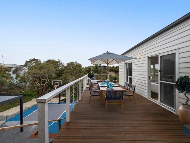 Classic Beach House with Exceptional Outdoor Living and Secure Garage