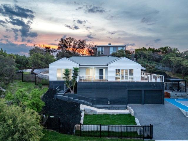 Classic Beach House with Exceptional Outdoor Living and Secure Garage