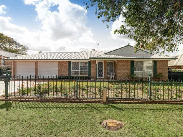 Classic Brick Charm Meets Sun Drenched Living with a Rose Garden Dream