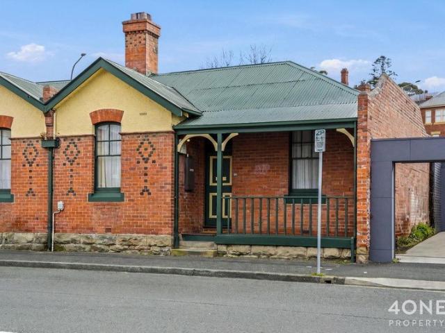 Classic Cottage Charm, Right in the Heart of the City