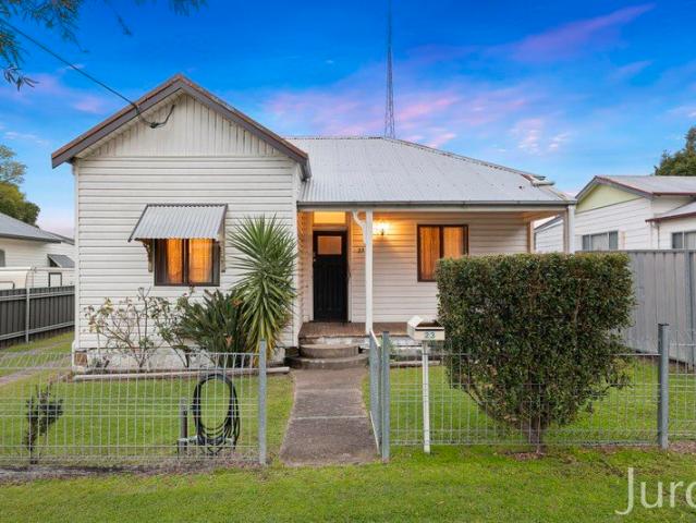 Classic Cottage Charm with Side Access & Spacious Backyard