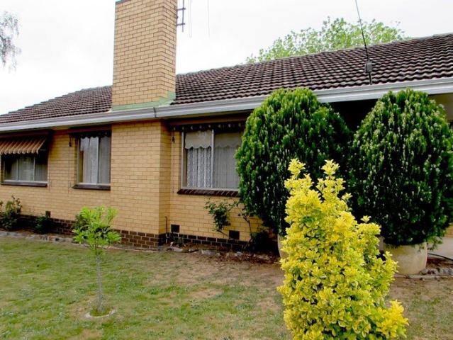 Classic Cream Brick Home Close to Town