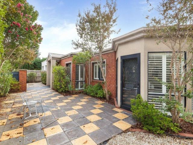 Classic Single Level Warmth garage entry on side street