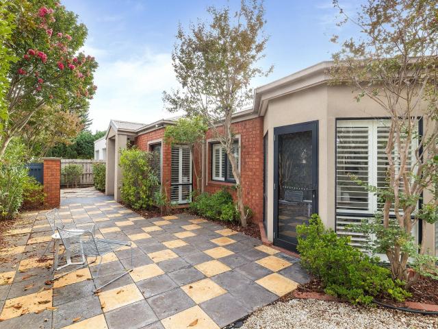 Classic Single Level Warmth garage entry on side street