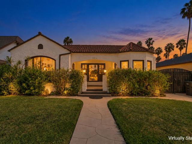 Classic Spanish Style Single Family Home with Hardwood Floors & Private Backyard