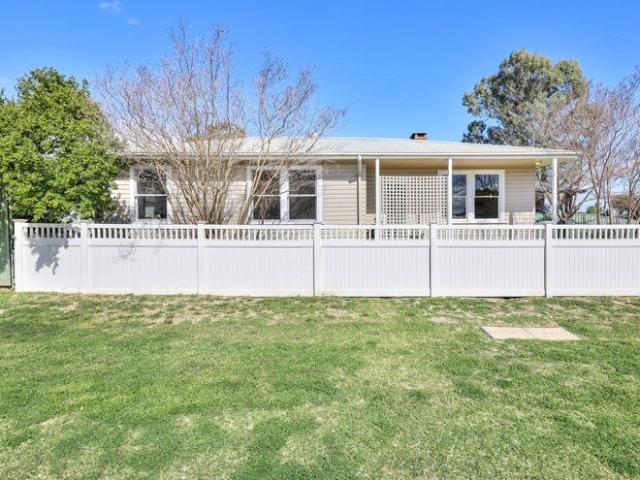 Classic Weatherboard Home in Central Position