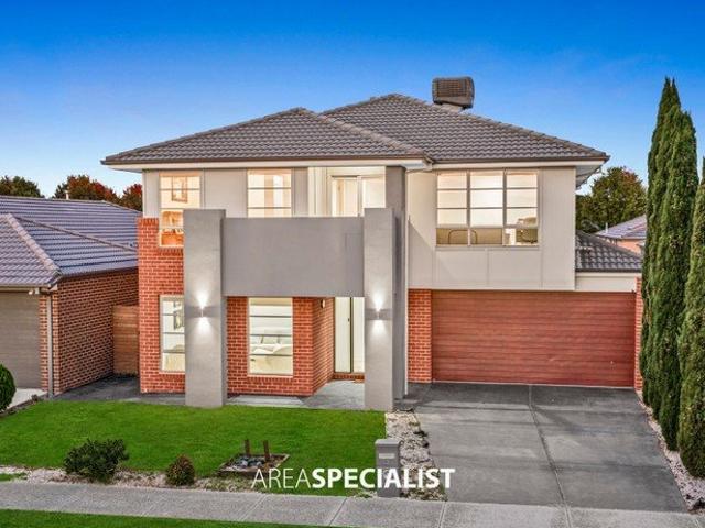 CLASSY FAMILY ENTERTAINER WITH THREE LIVING ZONES IN QUARTERS ESTATE