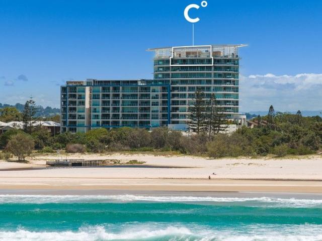 Crowning Kirra's Coastline with Iconic Two Level Penthouse Living