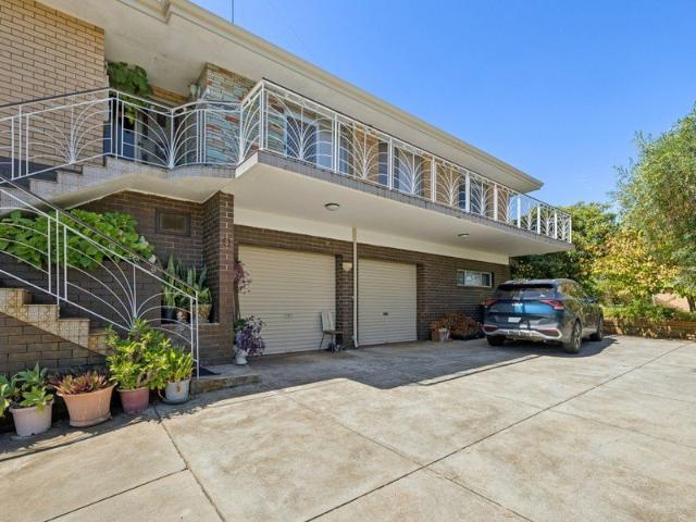 Craftsman Built Hilltop Living with Endless Potential