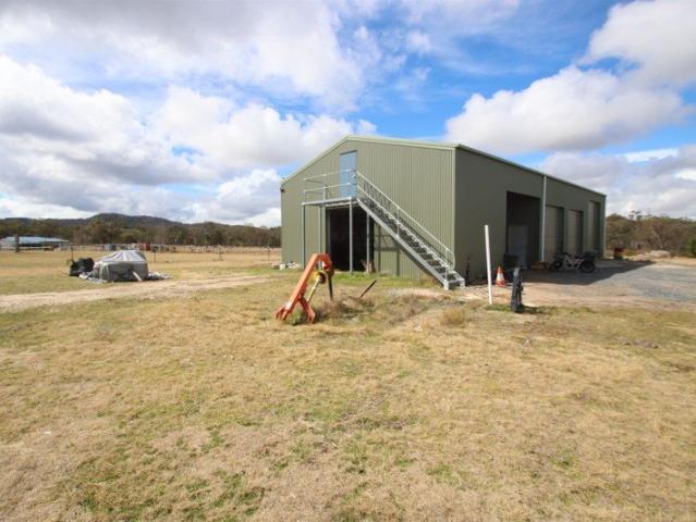 CREEK FRONT RURAL HOLDING WITH IMPRESSIVE SHED AND HORSE FACILITIES
