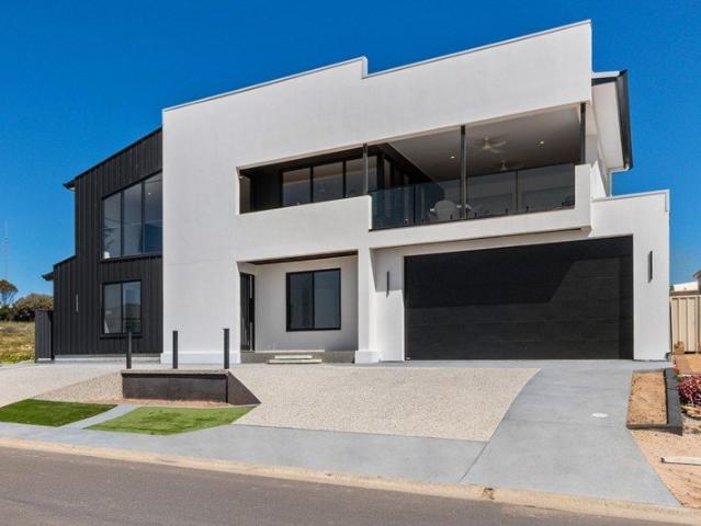 Custom built above the marina. Finished for the view