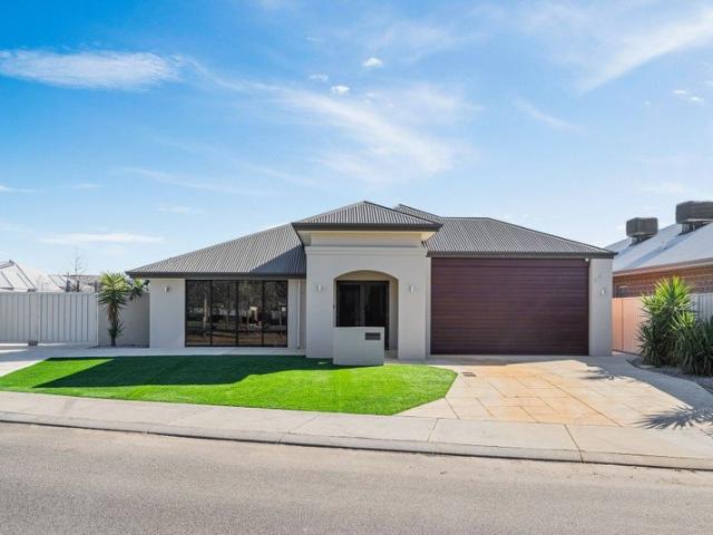 CUSTOM DESIGNED HOME FOR WHEELCHAIR ACCESSIBILITY ON A GENEROUS 819SQM CORNER BLOCK
