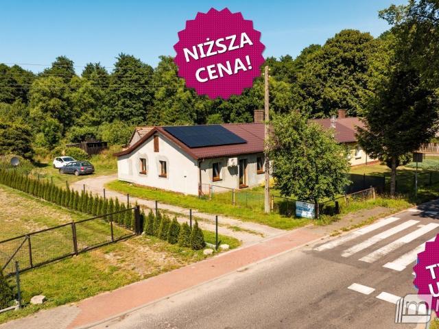 Skrajny dom z ogródkiem, fotowoltaiką i garażem