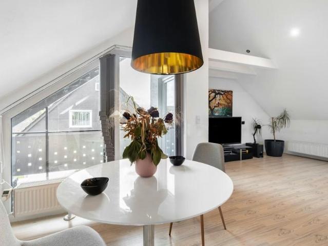 Dachgeschosswohnung mit Dachterrasse und Privatgarten
