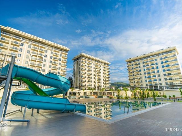 DEMİRTA'TA SATILIK 1+1 DENİZ VE HAVUZ MANZARALI DAİRE OTEL KONSEPTİNDE SİTE