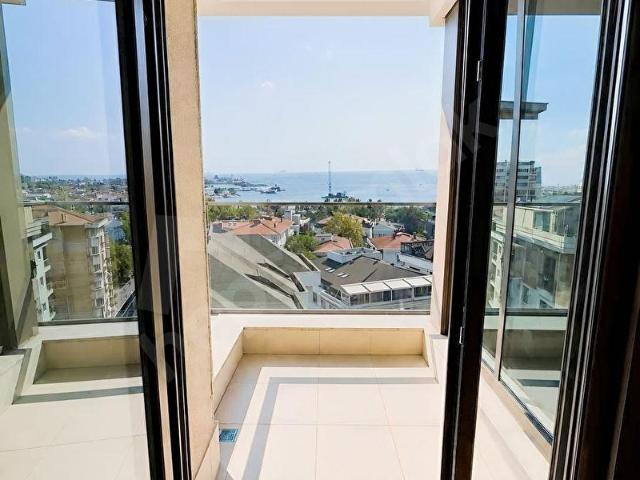 DENİZ VE MARİNA MANZARALI SIFIR BİNADA BALKON KAPALI OTOPARK