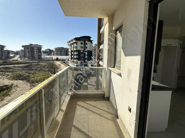 Denize Çok Yakın Konumda Full Aktiviteli 1+1 Lüx Sıfır Daire
