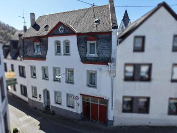Denkmalgeschütztes Mehrfamilienhaus mit Erweiterungsreserve in touristischer Lage