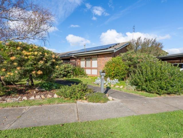 Deceptively Spacious Corner Block Living with Versatile Bungalow & Entertaining Appeal
