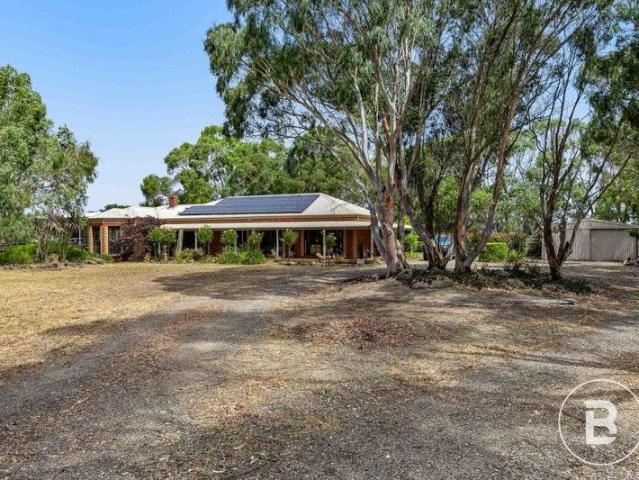 DELIGHTFUL FAMILY HOME WITH QUALITY SET UP FOR HORSES WITH TRACK AND STABLES