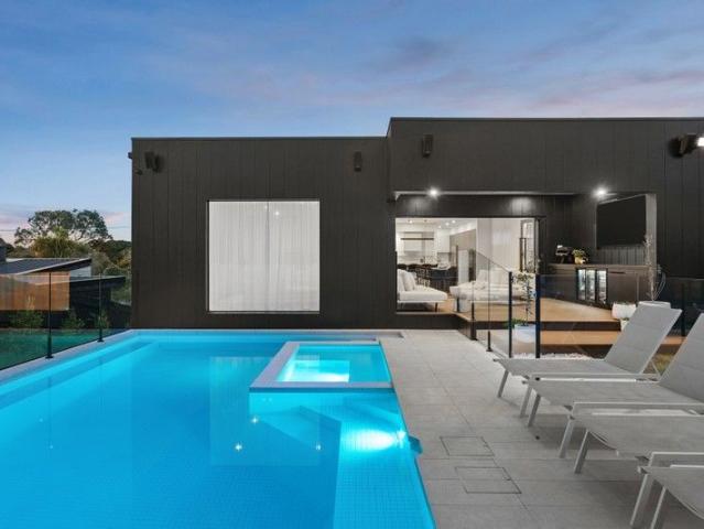 Designer Coastal Home with Poolside Entertaining Focus