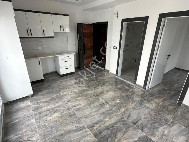 Didim Hisar Mahallesin'de Asansörlü Uygun Fiyata Sıfır 1+1 Daire