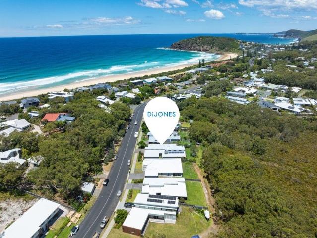 Discover Pacific Palms beachside luxury living only steps from Boomerang Beach to Bush