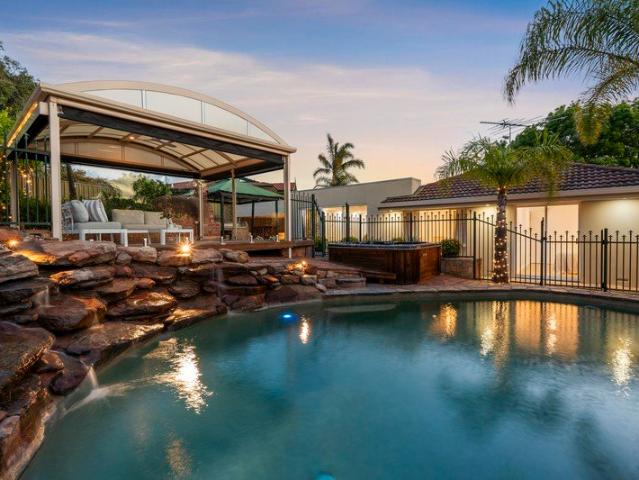 Dive into poolside perfection with a remodelled stone front stunner