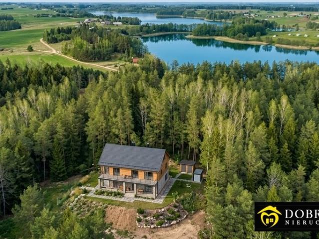 Do sprzedania nowoczesny dom 168 m² w lesie z garażem i prywatną działką