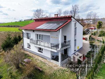Dom 120 m² z garażem, ogrzewaniem na drewno, fotowoltaiką