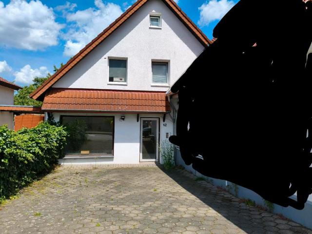Doppelhaushälfte mit Ladengeschäft und Garten in Melle Mitte