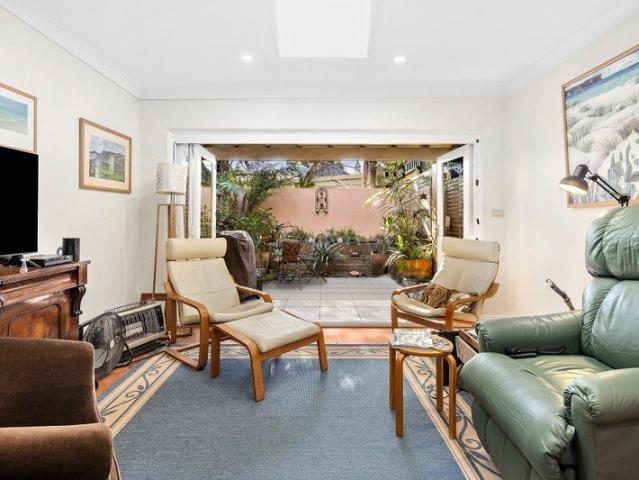 Double storey semi with north facing garden in village pocket