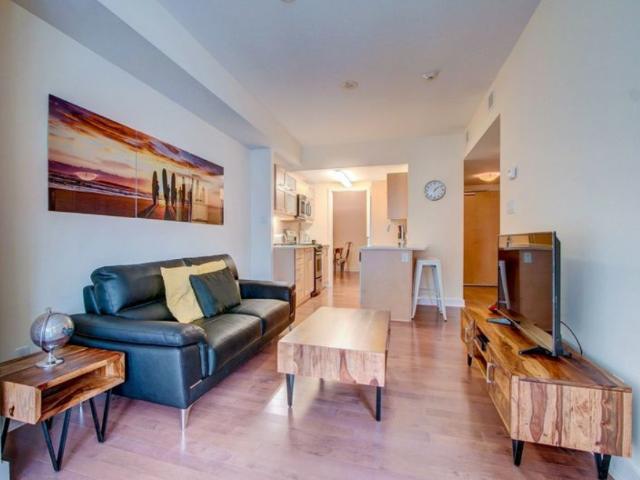 Downtown Ottawa Furnished Condo Rental at Tribeca East Spacious 1 Bedroom 1 Bathroom Suite with Hardwood Floors and Private Balcony