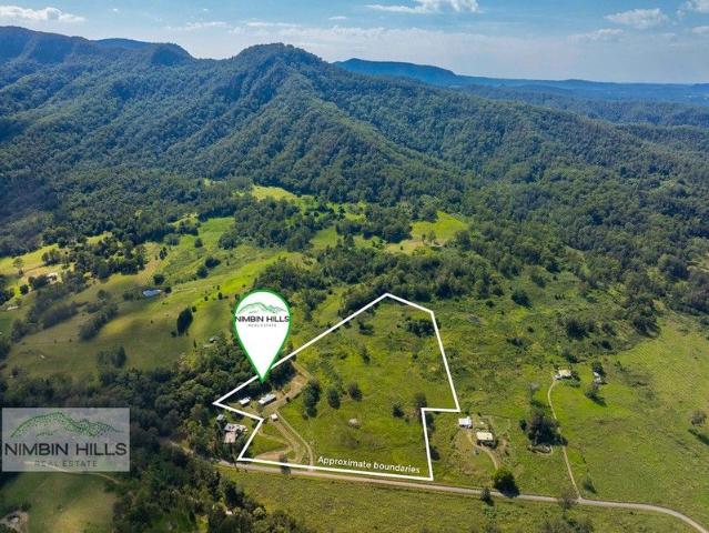 Dream Acres Move In Ready with Room to Build Your Forever Home!