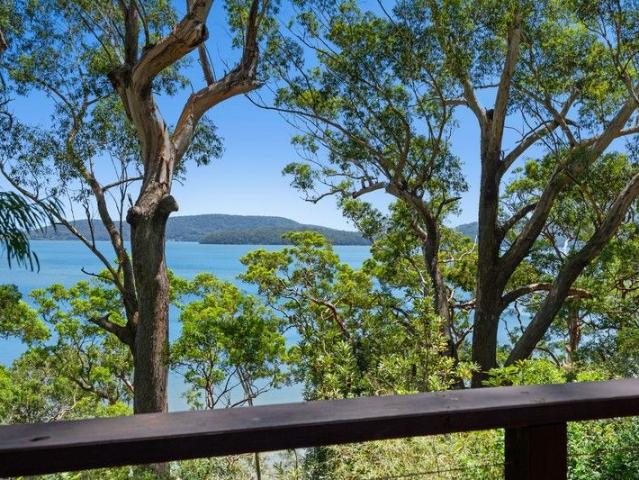 Dual Frontage Lakefront Property on One of Pacific Palms' Most Sought After Streets