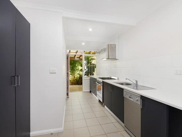 Dual level home with rear deck & garden plus secure parking