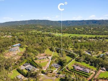 Dual Living Acreage Excellence in Prestigious Huntington Downs