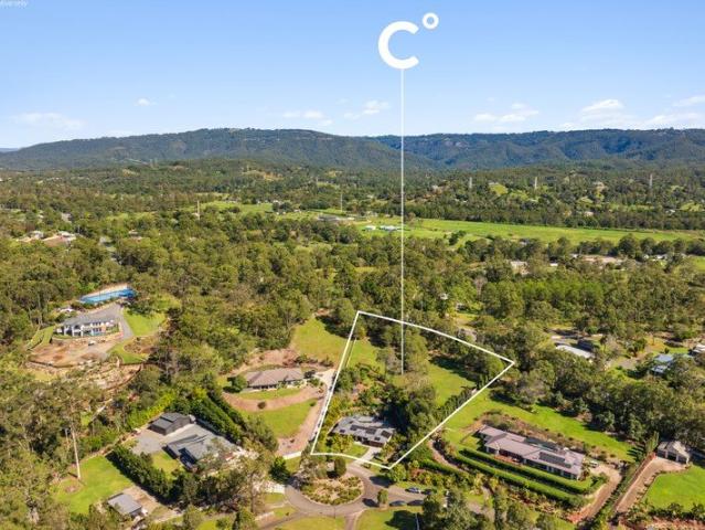 Dual Living Acreage Excellence in Prestigious Huntington Downs