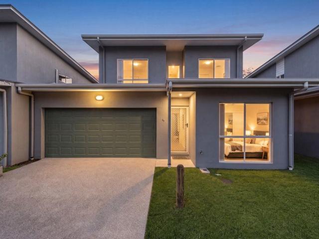 DUAL LIVING FLEXIBILITY WITH THE CONVENIENCE OF TOWNHOUSE LIVING!
