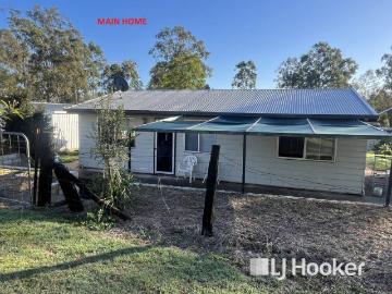 Dual Living Opportunity with Multiple Sheds on 4022sqm